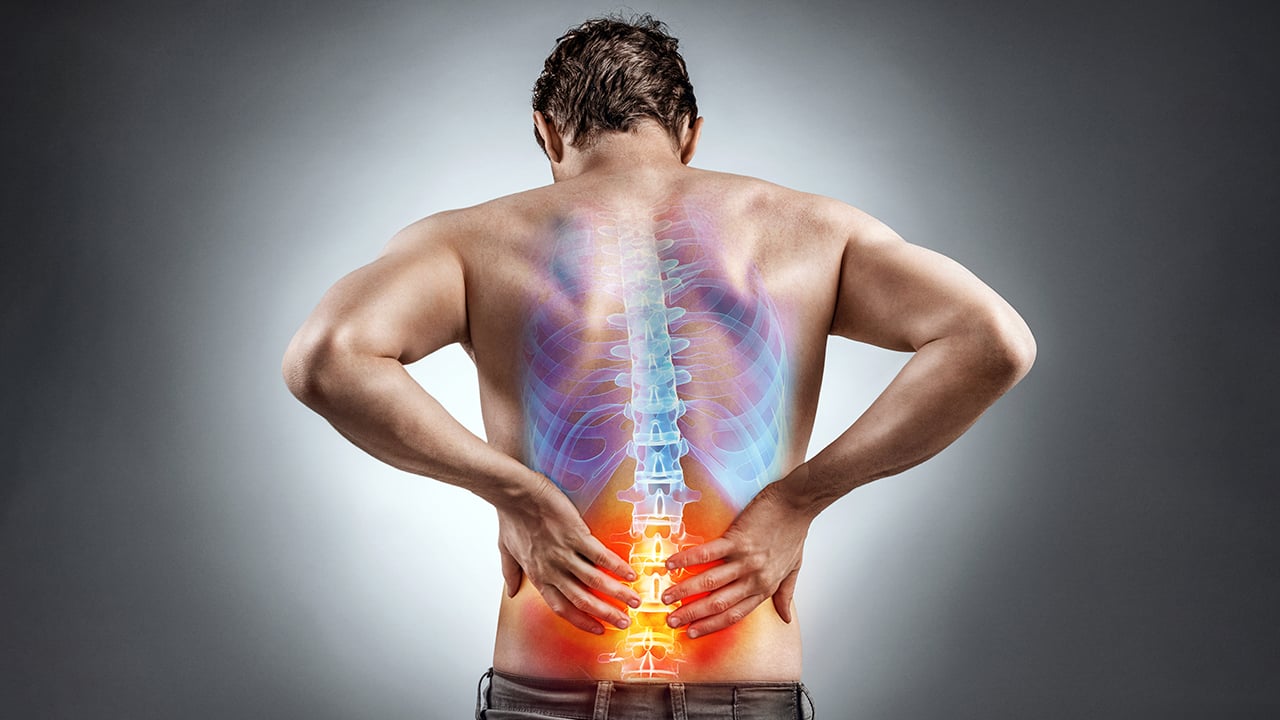 Diagram of man isolating lower back pain and looking for a chiropractor near me.