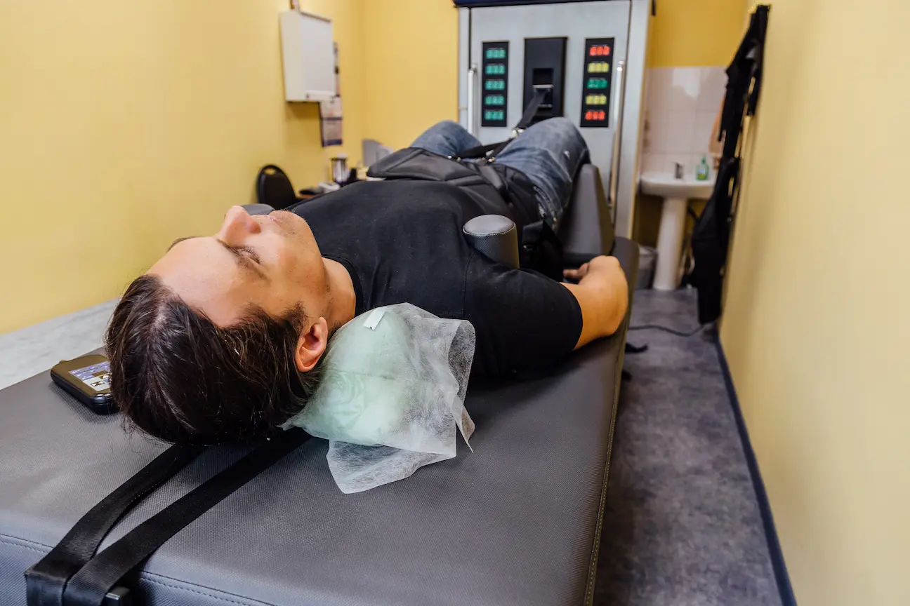 man undergoing decompression therapy